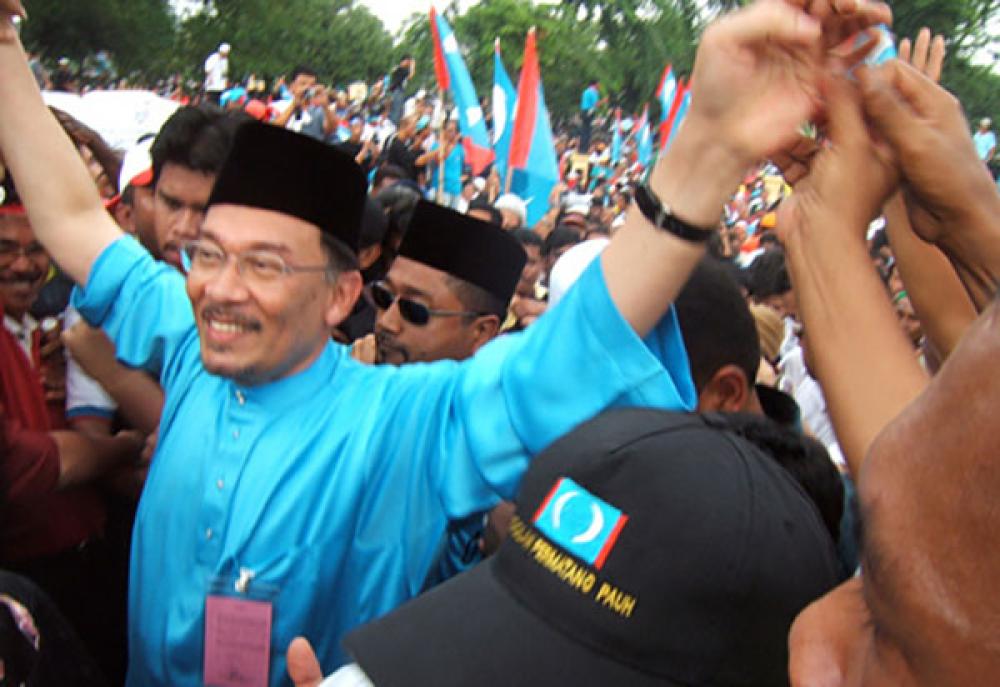 Datuk Seri Anwar Ibrahim waving to his supporters when he arrived at the nomination centre during the Pematang Pauh by-election