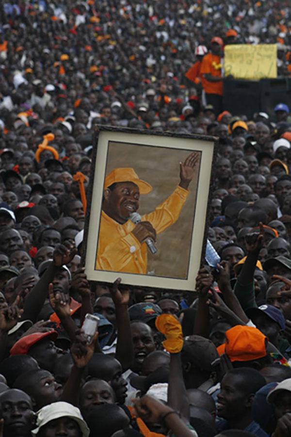 Orange Democratic Movement supporters hold up a portrait of Raila Odinga